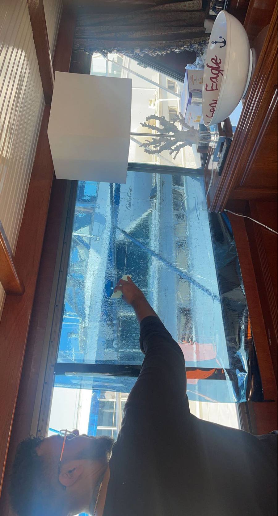 Marine window film installation inside yacht cabin