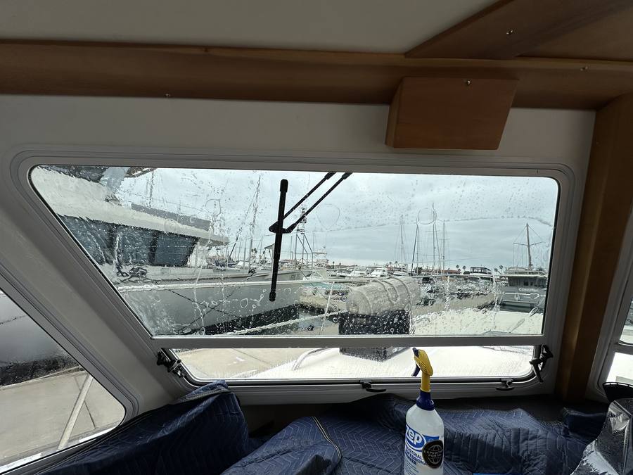 Pilothouse window film application on yacht