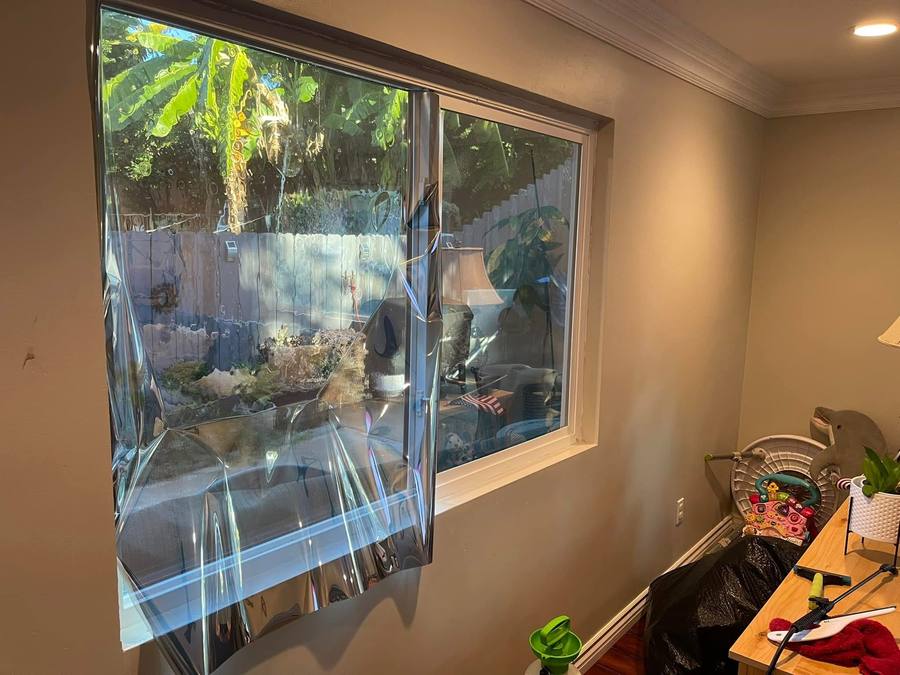 Window film being applied to home slider window