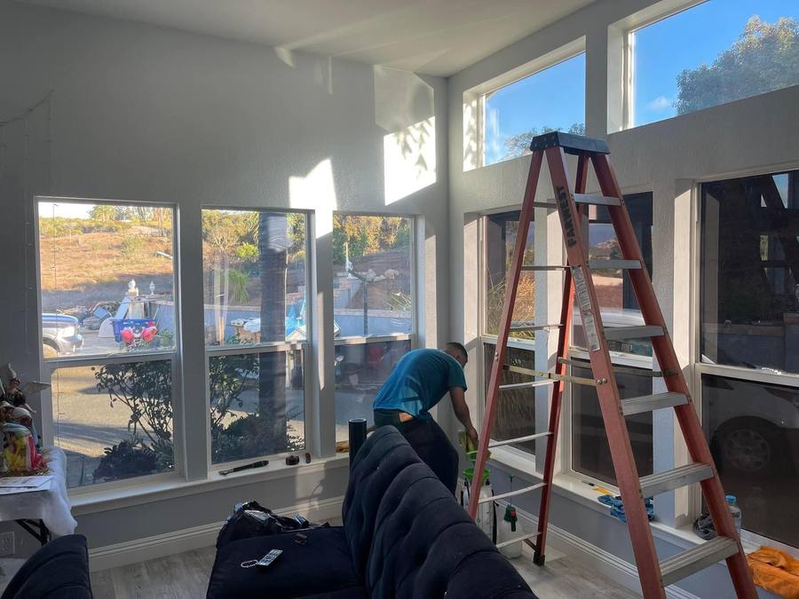 Professional residential window film installation in progress