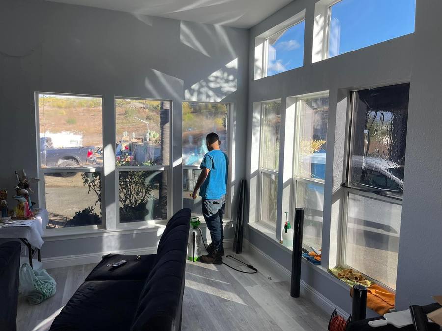 Tall window tint installation two-story home